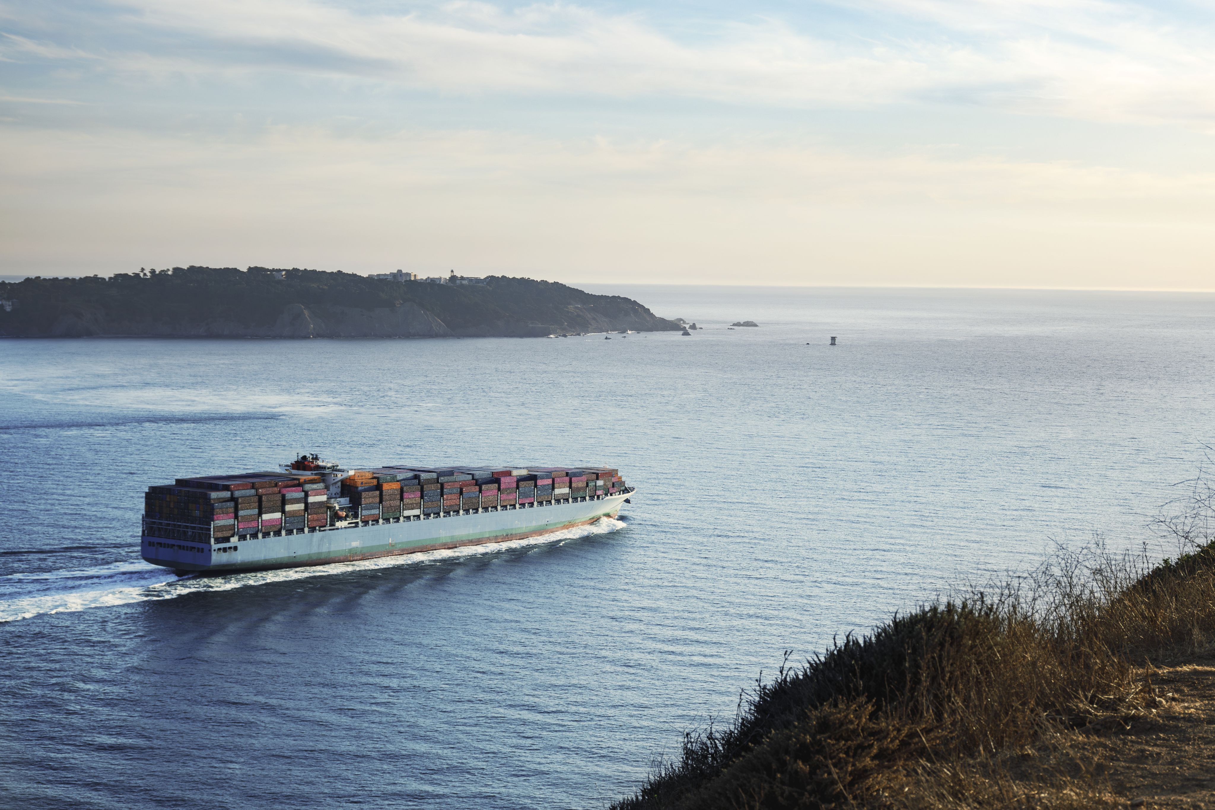 a large stack of colorful shipping containers